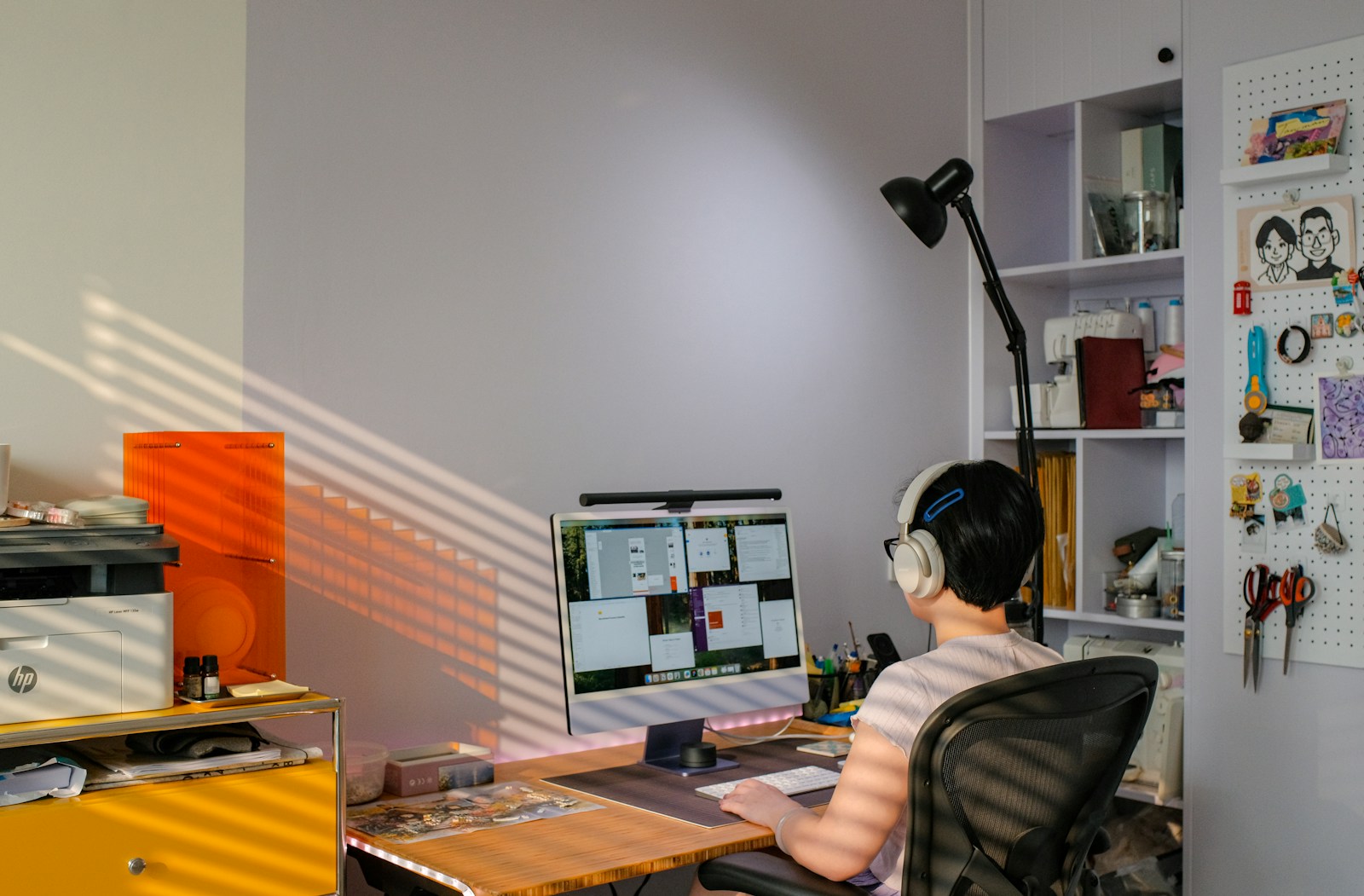 A person attends a virtual meeting on a computer.